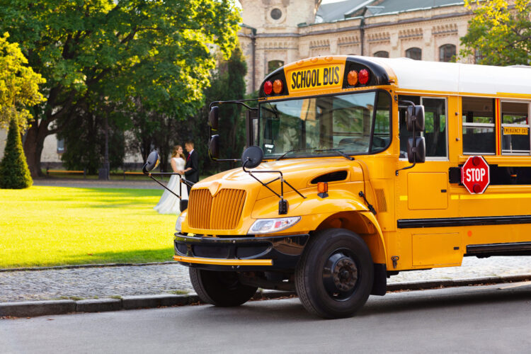 Big Yellow School Bus Stopped On Road With Red Stop Sign Out